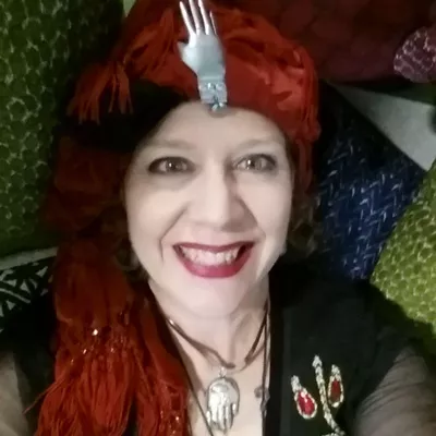 Laura E West, Fortune-teller & Lipsologist