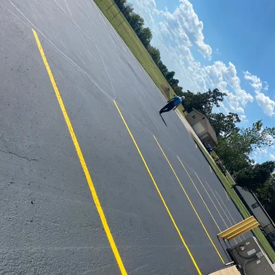 Holmes asphalt seal coating in repair